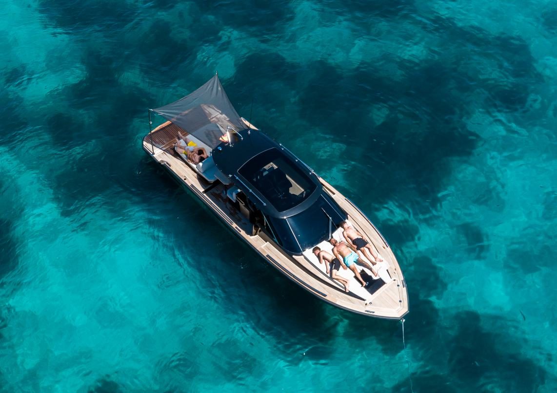 Aerial view of guests relaxing on the Forza 37 swim platform